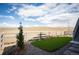 Turf backyard with rock groundcover featuring a split rail fence bordering the property at 8346 Mount Kataka St, Littleton, CO 80125