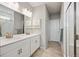 Bright bathroom with double vanity, modern fixtures, and a glass-enclosed shower at 8346 Mount Kataka St, Littleton, CO 80125
