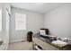 Neutral bedroom featuring light gray walls, carpet flooring, a white closet door and a window at 8346 Mount Kataka St, Littleton, CO 80125