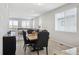 Charming dining area with natural light, wood floors, and views into the living room at 8346 Mount Kataka St, Littleton, CO 80125