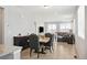 Open concept dining area with views of the TV lounge, offering seamless living and entertaining at 8346 Mount Kataka St, Littleton, CO 80125