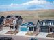 Charming two-story homes with solar panels sit atop a sunny landscape at 8346 Mount Kataka St, Littleton, CO 80125