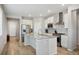 Bright, modern kitchen features stainless steel appliances and a large granite island at 8346 Mount Kataka St, Littleton, CO 80125