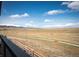 Balcony view of expansive landscape and mountain ranges on a sunny day with a fence line at 8346 Mount Kataka St, Littleton, CO 80125