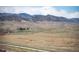 Scenic landscape with rolling hills and distant mountains, offering a tranquil and picturesque view at 8346 Mount Kataka St, Littleton, CO 80125