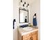 Clean bathroom with updated vanity and mirror at 1275 S Elizabeth St, Denver, CO 80210