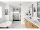 Modern bathroom with double vanity and walk-in shower at 1275 S Elizabeth St, Denver, CO 80210