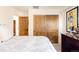 Bright bedroom with sliding closet doors and plush bedding at 1275 S Elizabeth St, Denver, CO 80210