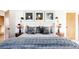 Bright bedroom with plush bedding and wood accents at 1275 S Elizabeth St, Denver, CO 80210