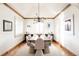 Elegant dining room with hardwood floors, a unique table, and stylish light fixture at 1275 S Elizabeth St, Denver, CO 80210