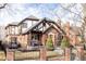 Brick home with a classic design, landscaped yard, and a brick fence at 1275 S Elizabeth St, Denver, CO 80210