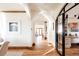 Bright hallway with hardwood floors, arched doorways and modern office at 1275 S Elizabeth St, Denver, CO 80210