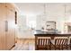 Modern kitchen with white cabinets, light wood island, and a large island at 1275 S Elizabeth St, Denver, CO 80210