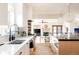 Modern kitchen with white cabinets, stainless steel appliances, and a large sink at 1275 S Elizabeth St, Denver, CO 80210