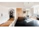 Island kitchen with dark countertops, white cabinets, and a view into the adjacent dining area at 1275 S Elizabeth St, Denver, CO 80210