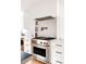 Modern kitchen with stainless steel appliances and white shaker cabinets at 1275 S Elizabeth St, Denver, CO 80210