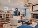 Cozy living room featuring stone fireplace, built-in bookshelves and elegant decor at 930 Kearney St, Denver, CO 80220