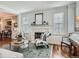 Bright living room with a marble fireplace, plantation shutters, and stylish furnishings at 930 Kearney St, Denver, CO 80220