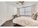 Bedroom featuring neutral walls, hardwood floors, and a window with blinds at 1200 Cherokee St # 206, Denver, CO 80204