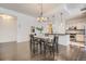 Open dining room with hardwood floors, adjacent to a modern kitchen at 1200 Cherokee St # 206, Denver, CO 80204