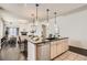 Kitchen area with a large island, open to the living room with fireplace at 1200 Cherokee St # 206, Denver, CO 80204