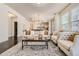 Open-concept living area with hardwood floors and seating area featuring a decorative area rug at 1200 Cherokee St # 206, Denver, CO 80204