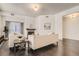 Bright living room featuring hardwood floors, a fireplace, and neutral-toned sofas with throw pillows at 1200 Cherokee St # 206, Denver, CO 80204