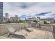 Rooftop patio featuring lounge chairs and city views at 1200 Cherokee St # 206, Denver, CO 80204