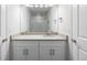 Bathroom featuring a single sink vanity, grey cabinets, and a large mirror at 2165 Peralta Loop, Castle Rock, CO 80104