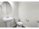 Bathroom features a pedestal sink, toilet and modern fixtures at 2165 Peralta Loop, Castle Rock, CO 80104