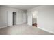 Bedroom featuring neutral carpet, a closet, and an ensuite bathroom at 2165 Peralta Loop, Castle Rock, CO 80104