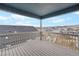 Enjoy the neighborhood views from this spacious covered deck with white railings at 2165 Peralta Loop, Castle Rock, CO 80104