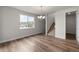 Open dining room with a view of the neighborhood and adjacent staircase at 2165 Peralta Loop, Castle Rock, CO 80104