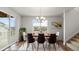 Bright dining room with a view of the neighborhood and space for six chairs at 2165 Peralta Loop, Castle Rock, CO 80104