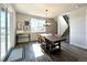 Sunlit dining room with hardwood floors and access to deck at 2165 Peralta Loop, Castle Rock, CO 80104