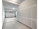 Two car garage with concrete floors, drywall, and white overhead garage door at 2165 Peralta Loop, Castle Rock, CO 80104