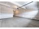 Spacious two car garage with concrete floors, drywall, and garage door opener at 2165 Peralta Loop, Castle Rock, CO 80104
