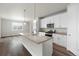 Well-lit kitchen features white cabinets, modern island, and stainless steel appliances at 2165 Peralta Loop, Castle Rock, CO 80104