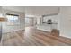 Open-concept living room showcases wood-look floors, abundant natural light, and a modern kitchen at 2165 Peralta Loop, Castle Rock, CO 80104