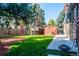 Side yard with playset, storage shed, and walkway at 10250 W 80Th Ave, Arvada, CO 80005