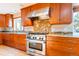 Modern kitchen, granite counters, and stainless steel range at 10250 W 80Th Ave, Arvada, CO 80005