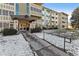 Building exterior with manicured lawn and walkway leading to the entrance at 775 S Alton Way # 2C, Denver, CO 80247