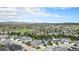 Expansive aerial view of a well-developed community with lush greenery and stunning mountain views in the background at 3091 Keepsake Way, Castle Rock, CO 80109