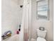 Bright bathroom features a tiled shower-tub combo and marble-like tiling at 3091 Keepsake Way, Castle Rock, CO 80109