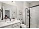 Bright bathroom with modern sink vanity and glass-enclosed shower at 3091 Keepsake Way, Castle Rock, CO 80109