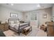 Cozy bedroom with stylish furniture, neutral colors, and ample natural light at 3091 Keepsake Way, Castle Rock, CO 80109