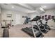 Home gym featuring treadmill, exercise bike, and motivational decor at 3091 Keepsake Way, Castle Rock, CO 80109