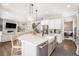 Open-concept kitchen featuring a large island, stainless steel appliances, and seamless flow to the living areas at 3091 Keepsake Way, Castle Rock, CO 80109