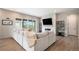 Comfortable living room with a fireplace, modern decor, and sliding glass doors to an outdoor seating area at 3091 Keepsake Way, Castle Rock, CO 80109