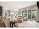 Spacious living room featuring modern furniture, a large sectional couch, and sliding glass doors to the outside at 3091 Keepsake Way, Castle Rock, CO 80109